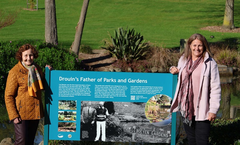 Jenny Boeyen and KarenThomson with Drouin's Father of Parks and Gardens sign