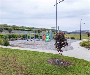 The area features footpaths, bins and solar lighting